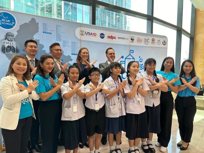 Nion Sirimongkollertkul with a group of Blue School students