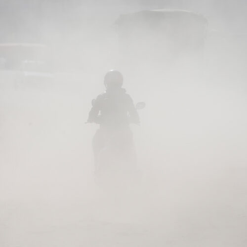 A motorcyclist rides through a polluted road in Lalitpur, Nepal. Photo: Skanda Gautam CC BY-NC-ND 4.0