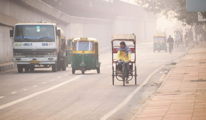 a person riding a bike on a crowded street