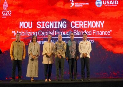 siz people standing in front of ceremony sign