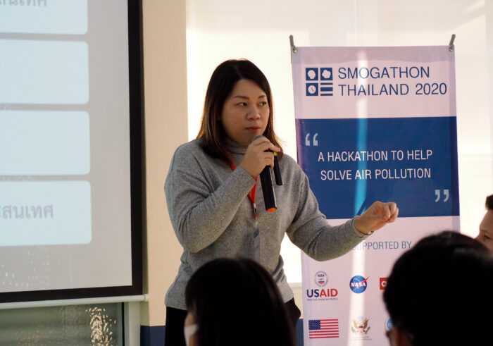 a woman giving a presentation